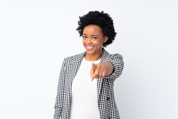 African american woman with blazer on isolated white points finger at you with a confident expression