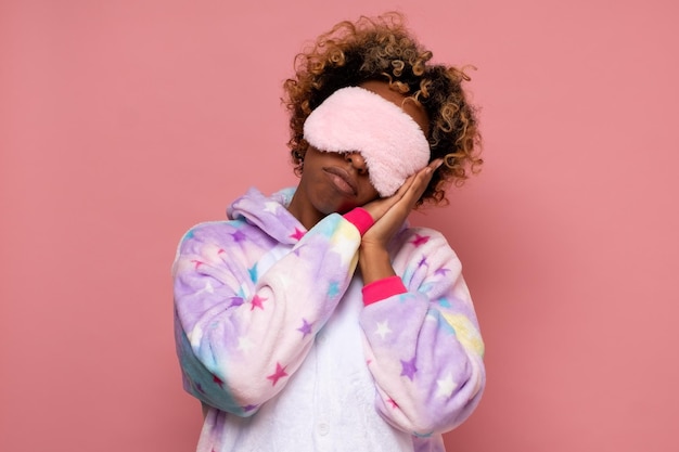 African american woman with eye mask on head ready for sleep\
having a rest or nap