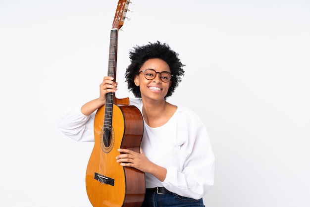 African american woman with guitar over isolated wall