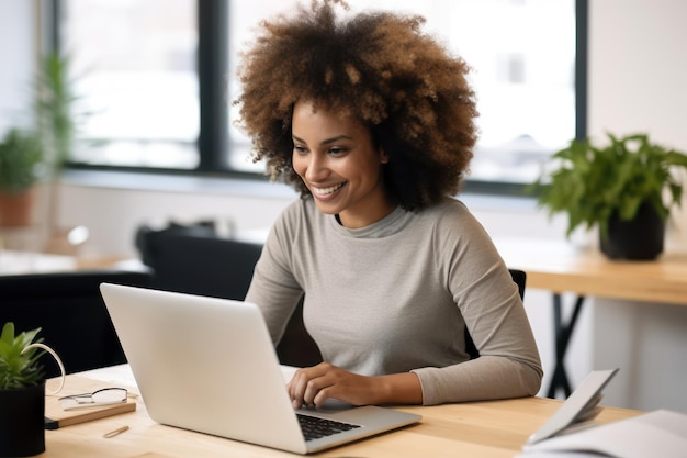 African american young woman using laptop and smiling