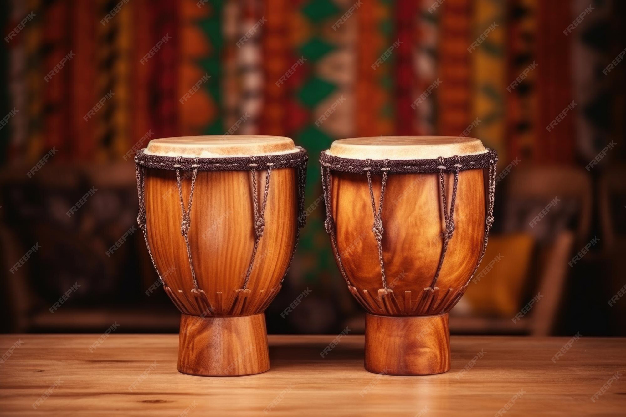Premium Photo African bongo drums on a wooden surface