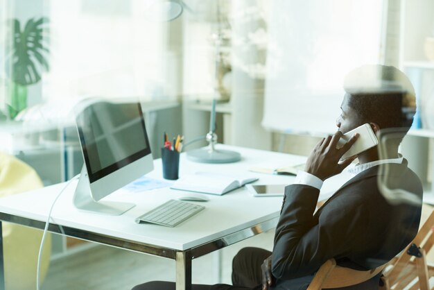 African Businessman Speaking by Phone