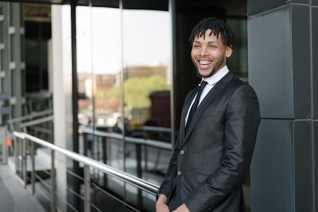 African businessman in suit at street