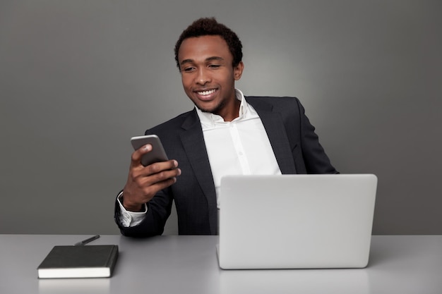 African businessman texting