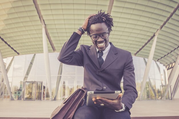 African businessman working with tablet outdoor