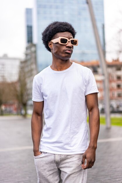 African cool man in summer white clothes in the city