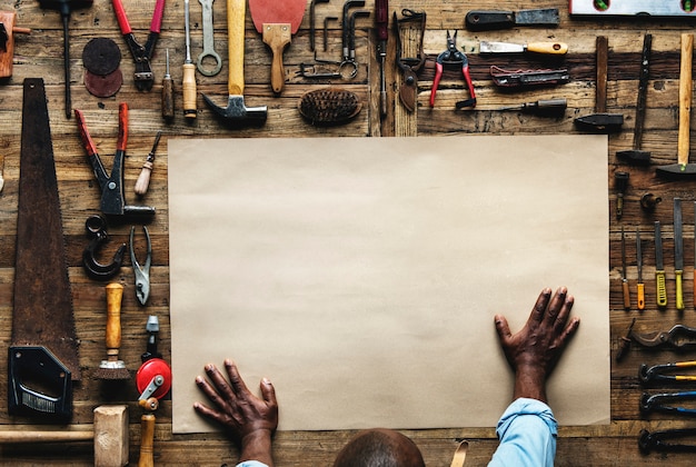 African descent carpenter working on the table