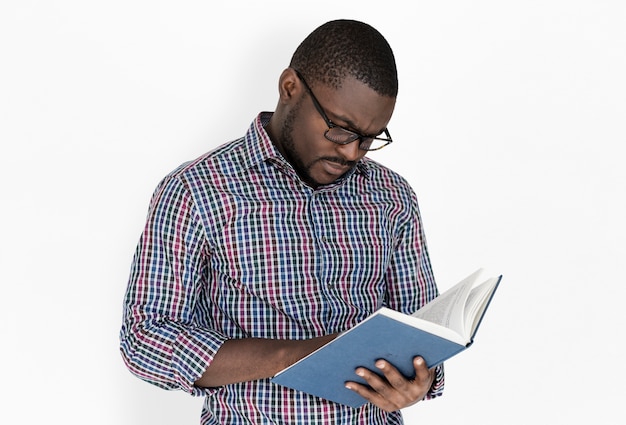 African descent man is reading a book