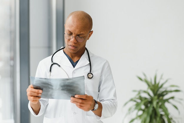 African doctor looking at a radiography