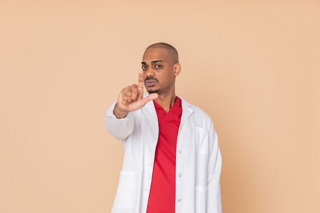 African doctor pointing at camera