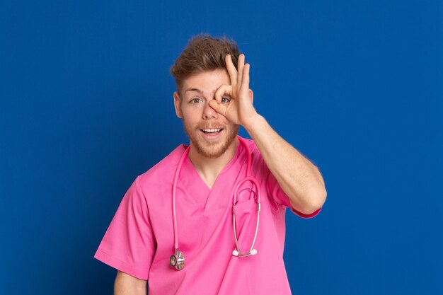 African doctor wearing a pink uniform