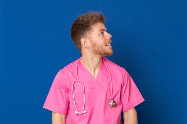 African doctor wearing a pink uniform