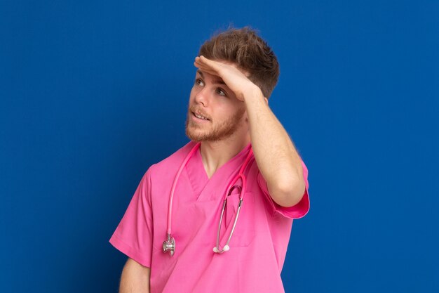 African doctor wearing a pink uniform