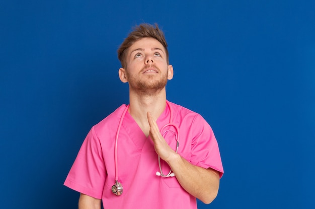 African doctor wearing a pink uniform