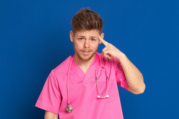 African doctor wearing a pink uniform