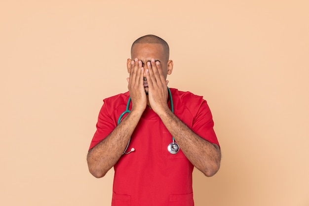 African doctor wearing red uniform