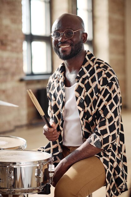 African drummer enjoying playing drums