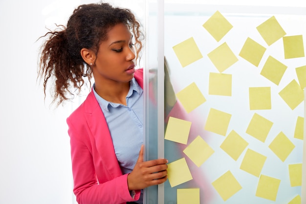 African ethnic executive with stickers in office