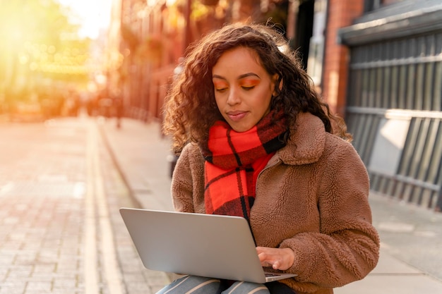 African Ethnicity young woman watching online education webinar using a laptop