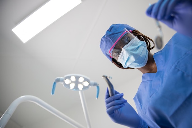 An African female dentist during a visit point of view of the patient's mouth shot with copy space