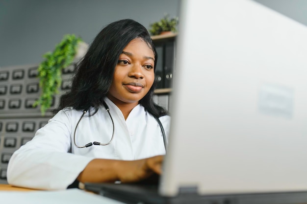 African female doctor make online telemedicine video call\
consult patient afro american black woman therapist talking to\
camera in remote videoconference chat webcam view face\
headshot