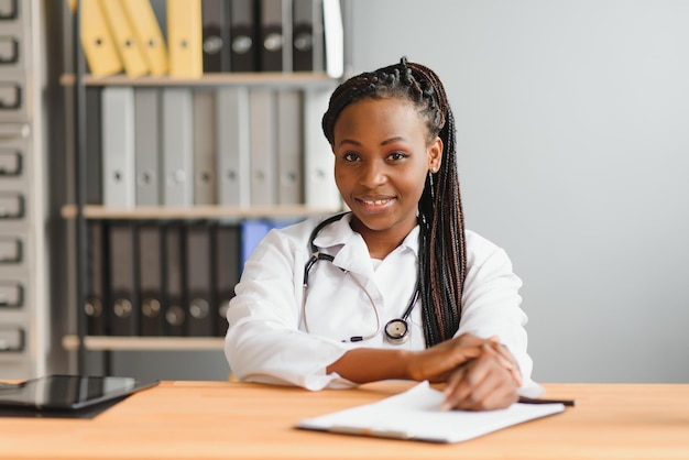 African female doctor make online telemedicine video call\
consult patient afro american black woman therapist talking to\
camera in remote videoconference chat webcam view face\
headshot