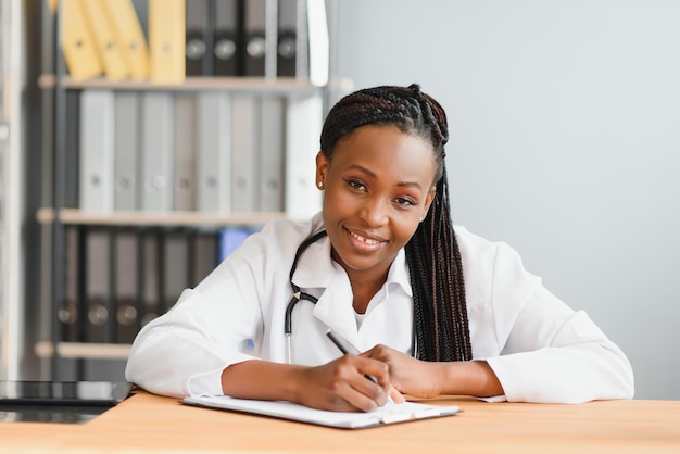 African female doctor make online telemedicine video call\
consult patient afro american black woman therapist talking to\
camera in remote videoconference chat webcam view face\
headshot