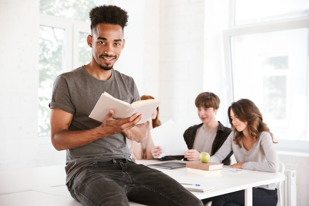 African guy reading book