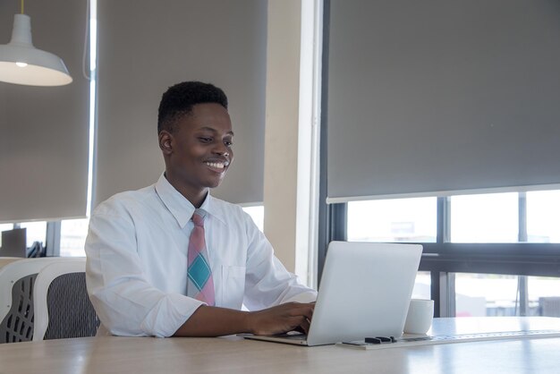 African guy use notebook smile and happy