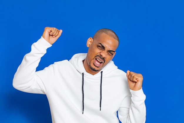 African guy wearing a white sweatshirt