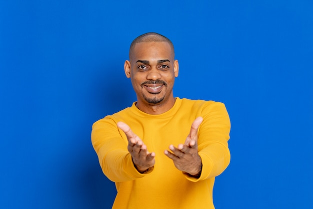 African guy with a yellow jersey