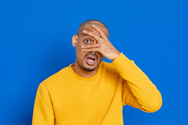 African guy with a yellow jersey