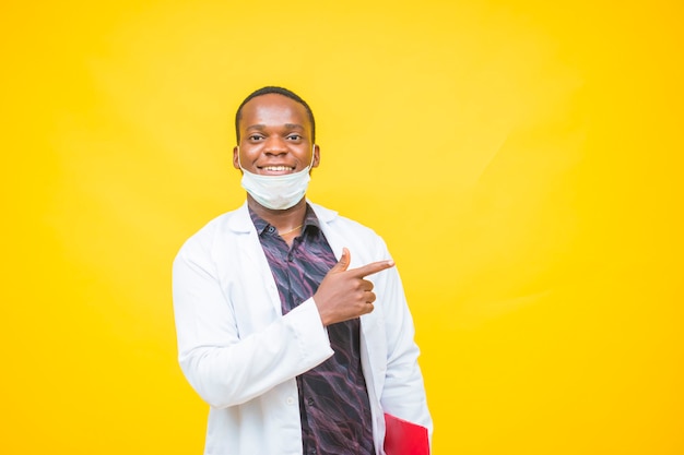 African male doctor wears a protective mask