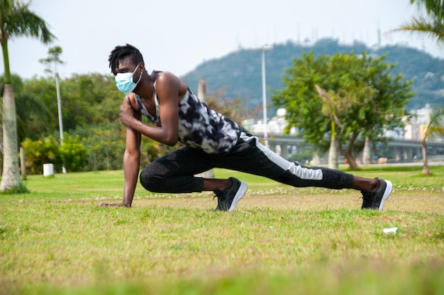 African man athlete on a summer day practicing physical activity outdoors in the park