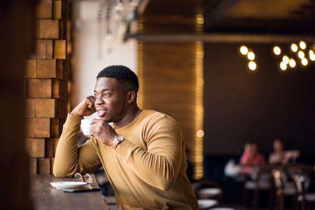 African man in a cafe