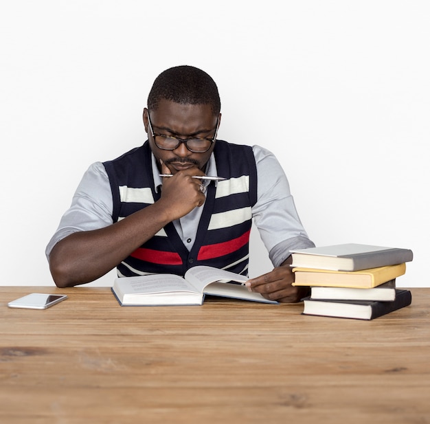 African Man Curious Thinking Reading Book Studio Portrait