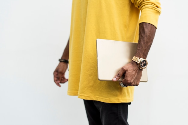 African man holding a laptop