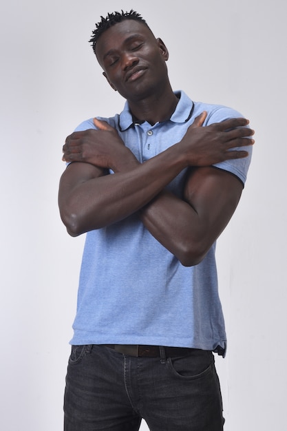 African man hugging on white background