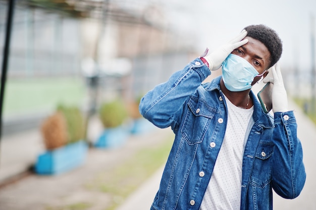 African man at park wearing medical masks protect from infections and diseases coronavirus virus quarantine.