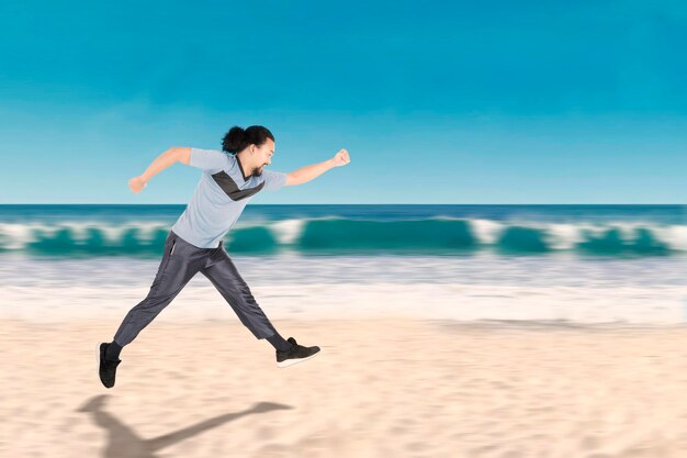 African man running on the beach