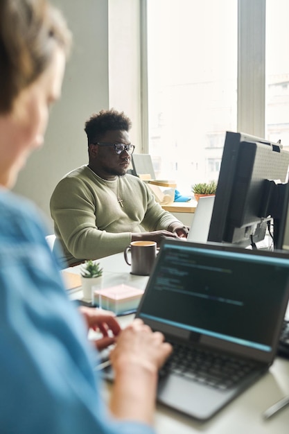 African man working on computer at office