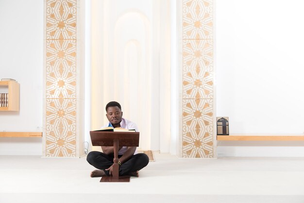 African Muslim Man Reading Holy Islamic Book Koran