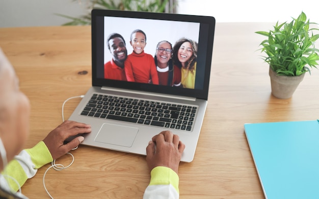 African senior woman doing video call with her family during coronavirus lockdown