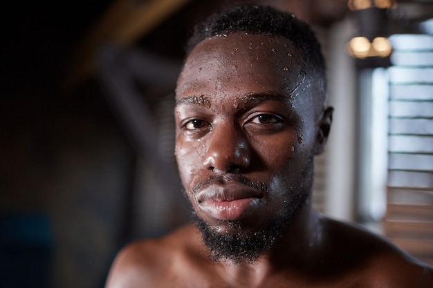 African shirtless man in gym