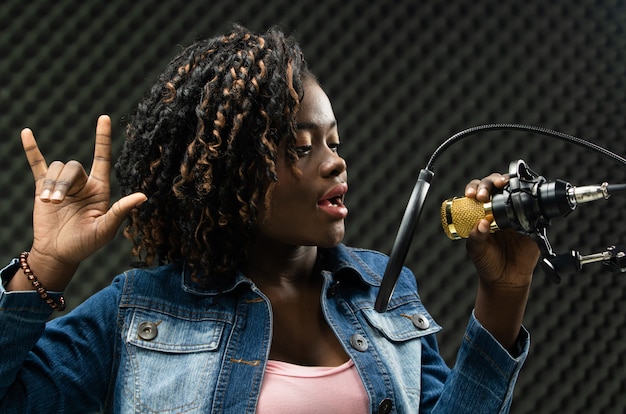 African Teenager Woman Afro hair sing a song