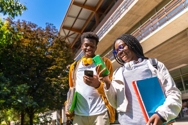 african university students using phone outside the university campus