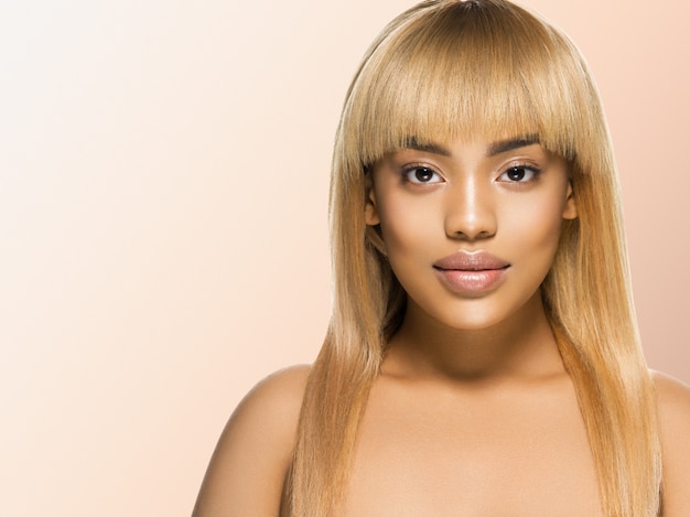 African woman beauty portrait girl with healthy skin and beautiful hair. Studio shot.