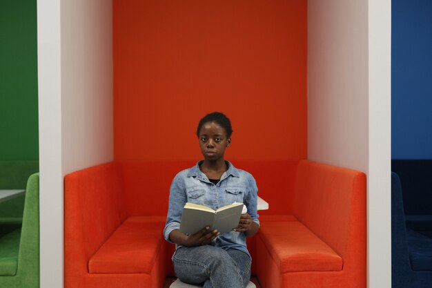 African woman reading a book