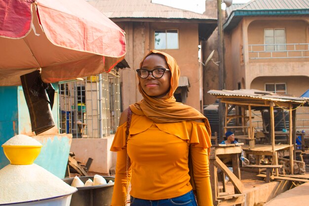 African woman shopping food stuff in a local market