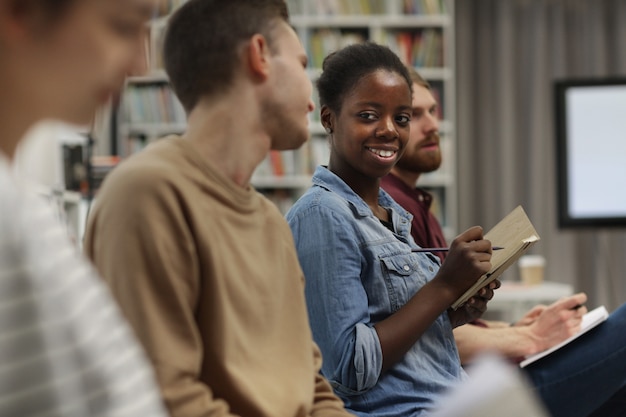 African woman sitting at lecture